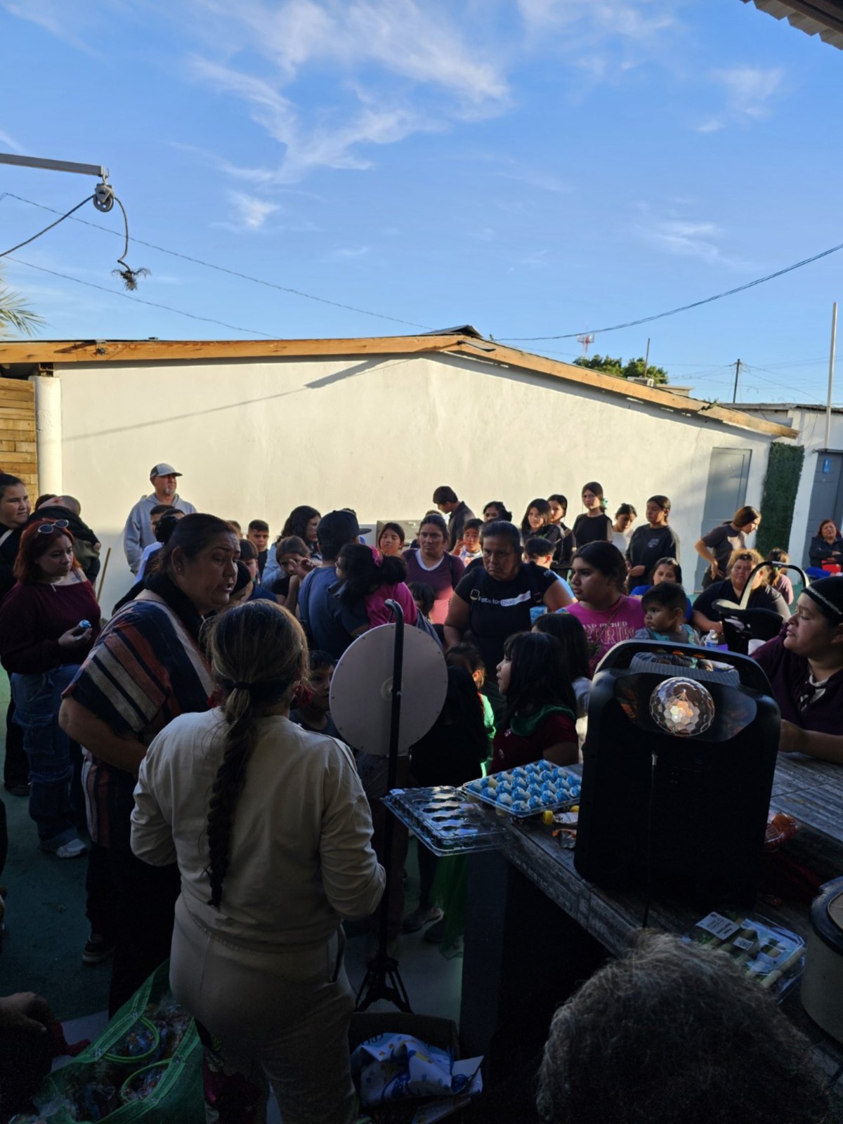 Large crowd gathering at a Happy Homes Foundation event